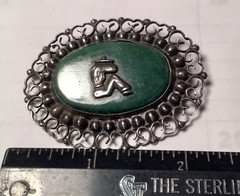A vintage sterling silver made in Mexico brooch. Mexico jade with man siesta .