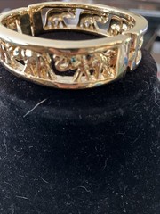gold tone elephant hinged bracelet Trunks Up Green Eyes Unsigned