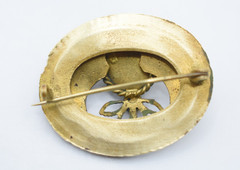 Antique Egyptian Revival winged scarab brooch featuring vibrant enamel work