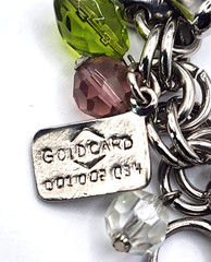 Vintage silvertone & glass charm bracelet with rare car, gold card, cell phone