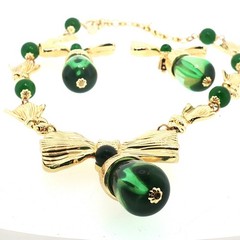 Vintage Catwalk John Jewelry Set – Gold‑Tone Bow Necklace & Green Drop Earrings