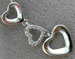 ESTATE .06CT DIAMOND 14KT WHITE GOLD 3D OPEN TRIPLE HEART FLOATING LOVE PENDANT