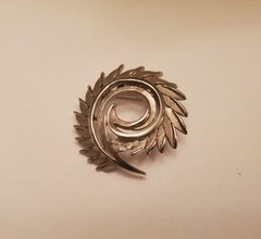 Silver-Tone Spiral Brooch Features A Brushed Feather Design