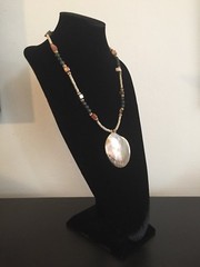 Shell Pendant on a Green, Gold, and Tan Necklace – 25.25 in.