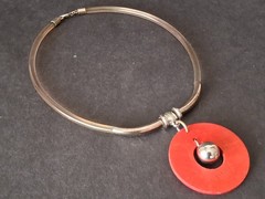 Aarikka Finland necklace with a vibrant red wooden ring pendant