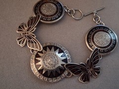 Mexican alpaca silvertone butterfly & Aztec sun medallion bracelet. 7″