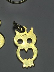 5.50 14K SOLID YELLOW GOLD, 6 14K Charms and one heavy charm holder