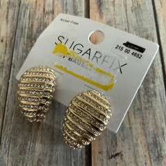 Signed sugarfix rhinestone egg shaped pierced earrings in gold tone