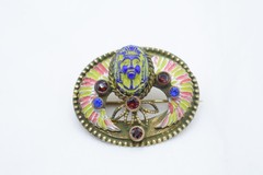 Antique Egyptian Revival winged scarab brooch featuring vibrant enamel work