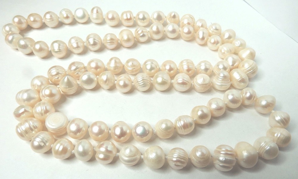 OVER 80 PIECES OF FRESHWATER WHITE PEARL 10MM, NECKLACE 32″ LONG