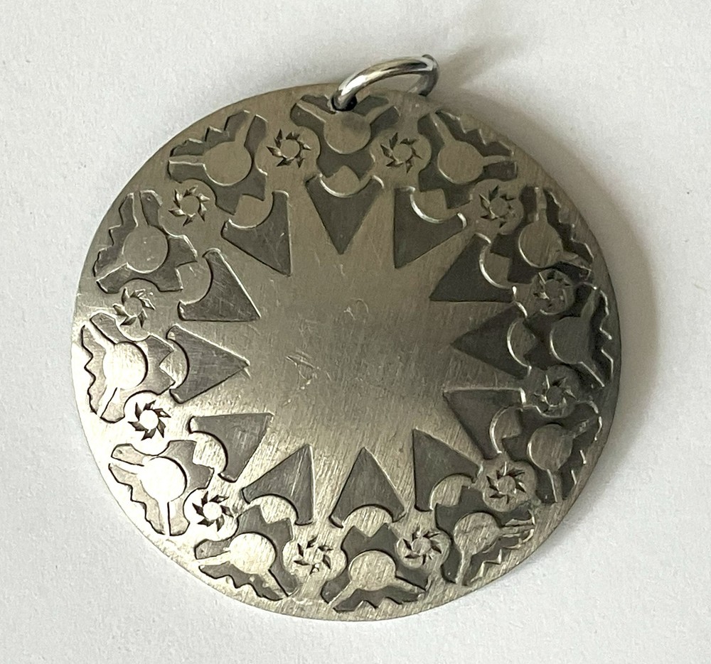 Rolf Buodd pewter pendant, circular with star in centre 45mm in diameter