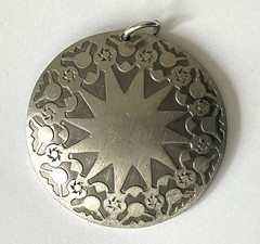 Rolf Buodd pewter pendant, circular with star in centre 45mm in diameter