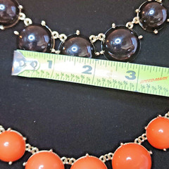 2 Statement Necklaces each 18″-20″ one Black and one Orange.