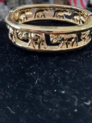 gold tone elephant hinged bracelet Trunks Up Green Eyes Unsigned