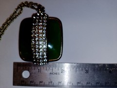 Nice faux jade gold tone necklace with strip of rhinestones. 19″ total 2″ stone