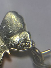 5.50 14K SOLID YELLOW GOLD, 6 14K Charms and one heavy charm holder