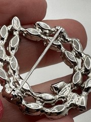 Vintage B. David silver tone brooch featuring rhinestones