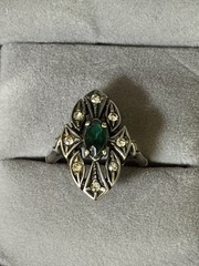 Antique ring with unknown dark teal marquis shaped stone And Clear Round Stones
