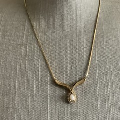 Vintage man made low grade opal and garnet v necklace in gold tone