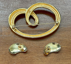 Vintage “Monet” gold-tone abstract swirling brooch and earring set