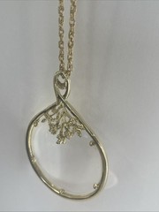 Vintage Magnifier Pendant Necklace. Gold tone. Made in USA in 1960’s. Hangs 15”