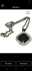 Vintage Art Deco Faux Onyx Pendant Framed by a Halo of Clear Stones.