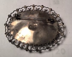 A vintage sterling silver made in Mexico brooch. Mexico jade with man siesta .