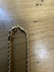 1 Watch, (2) 14 Karat Gold Plated Necklaces, (1 ) 14 Karat Gold Plated Bracelet