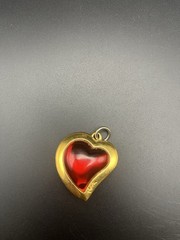 VTG 80’s Yves Saint Laurent (YSL) gold-tone metal and red resin heart pendant.