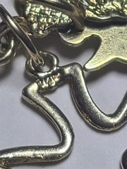 5.50 14K SOLID YELLOW GOLD, 6 14K Charms and one heavy charm holder