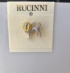 Rucinni Gold and White Lion brooch with White crystals and two green eyes.