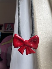 Vintage flying colors signed ceramic red bow Black Cord necklace