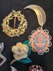 12 vintage Brooches. 1.5 inches – 3 inches big.