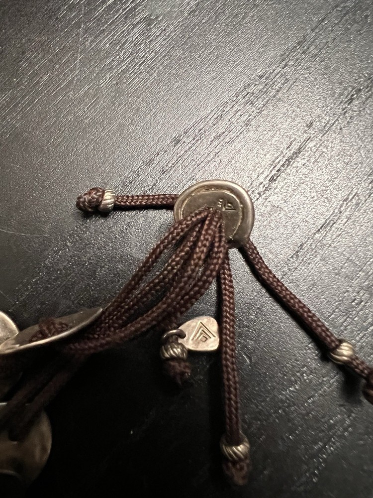 Silver Coin Bracelet with Tassel Accents
