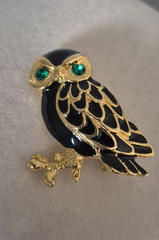 Cute, vintage owl brooch with black enamel and green rhinestone eyes