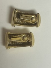 Vintage beige enamel and gold tone clip on earrings. 1.25 x .5 inches. Heavy.