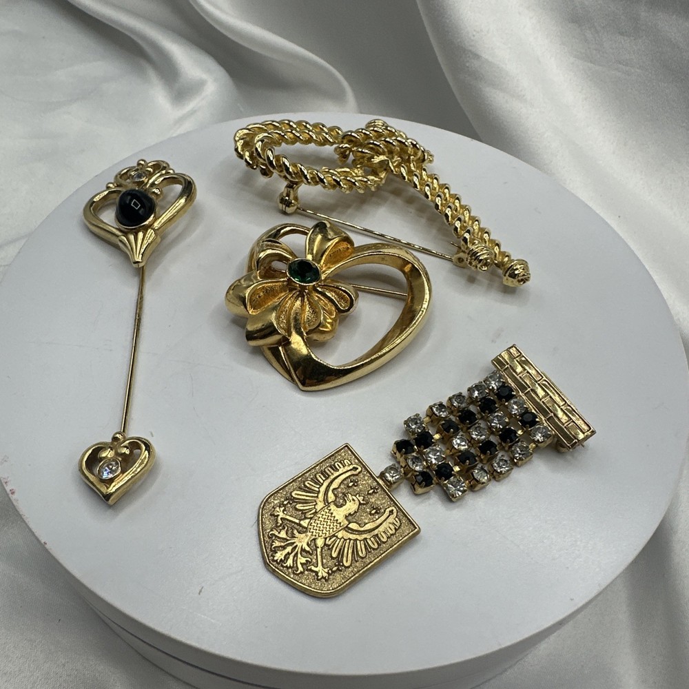 Three Mixed Vtg Gold Toned Brooches and One Pon.See pics.