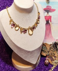 Vtg Cookie Lee faceted Purples/Yellows Lucite Charm Necklace on pale Gold chain