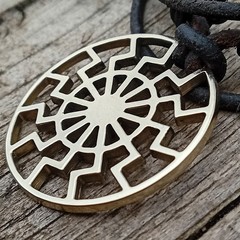 Black Sun Pendant Necklace – Brass Sonnenrad Medallion on Black Cord