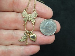 Vintage “1928 Jewelry” Gold Tone w/Butterfly Charm Holder w/Charms