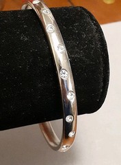 Crystal polka dot bangle bracelet Silvertone flush set stones eternity band