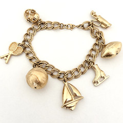 Vintage Monet Sports Theme Gold Tone Charm Bracelet Tennis Golf Skating 7 Charms