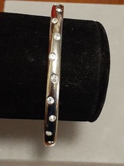 Crystal polka dot bangle bracelet Silvertone flush set stones eternity band