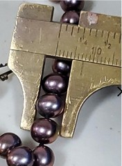 Genuine knotted pearl necklace with 14-karat yellow gold clasp