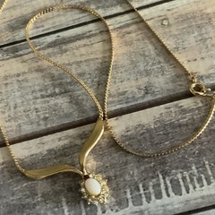 Vintage man made low grade opal and garnet v necklace in gold tone