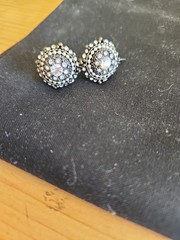 Vintage style costume jewelry earrings featuring a circular halo cluster design