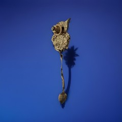 VTG Gold-tone metal articulated owl brooch with rhinestone eyes and dangle chain