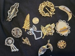 12 vintage Brooches. 1.5 inches – 3 inches big.
