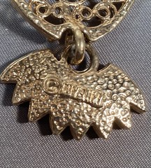 Sarah Coventry gold-toned owl pendant with black cabochon eyes.