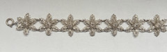 Antique Silver Bracelet featuring Finely detailed Filigree Flowers